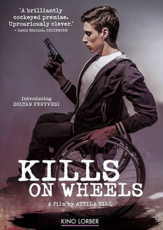 Main character Zolika, a young man, is in a wheelchair. He is facing the camera with his left side. He is holding a gun in his right hand.