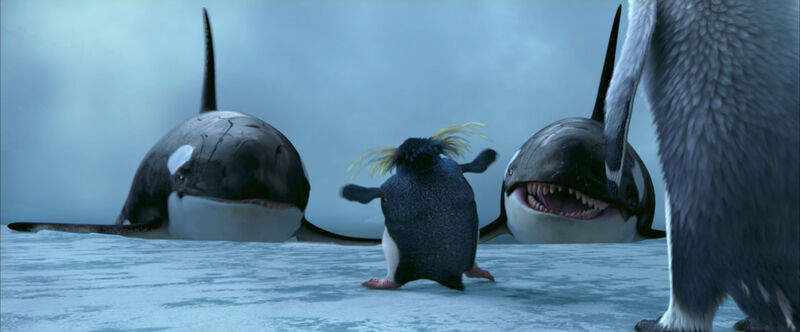 Still uit de film Happy Feet. Een pinguin houdt twee haaien op afstand